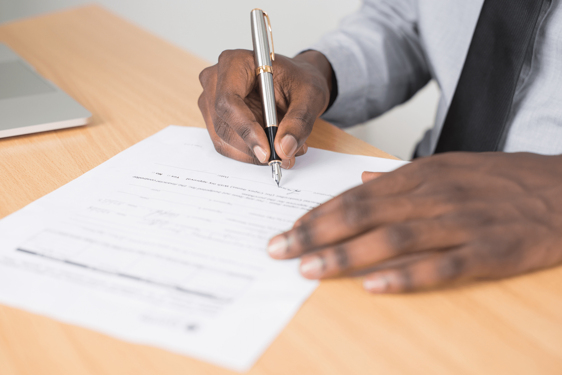 business man signing a contract with a fancy pen