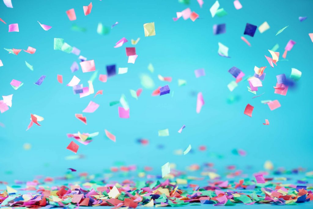 confetti falling from above and collecting on surface