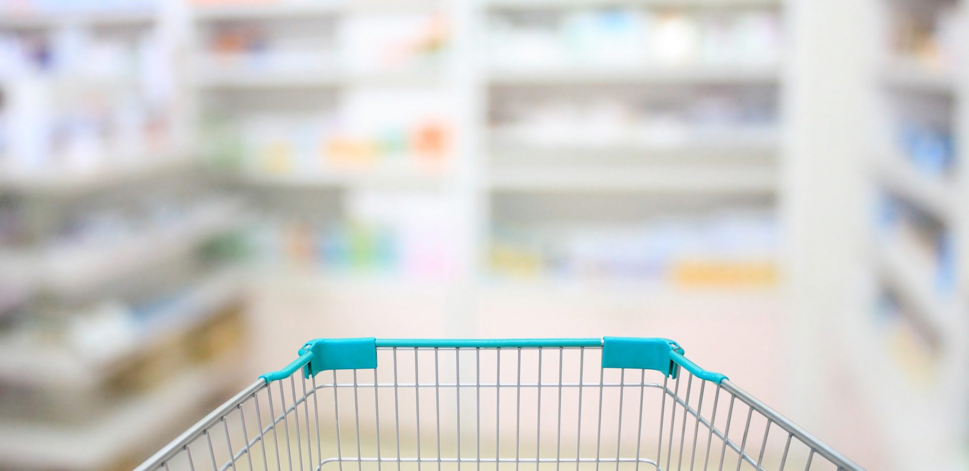 shopping cart with blurry shelves in distance