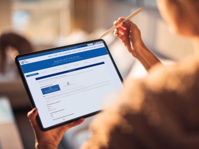 woman on Appeals and Grievance form on iPad
