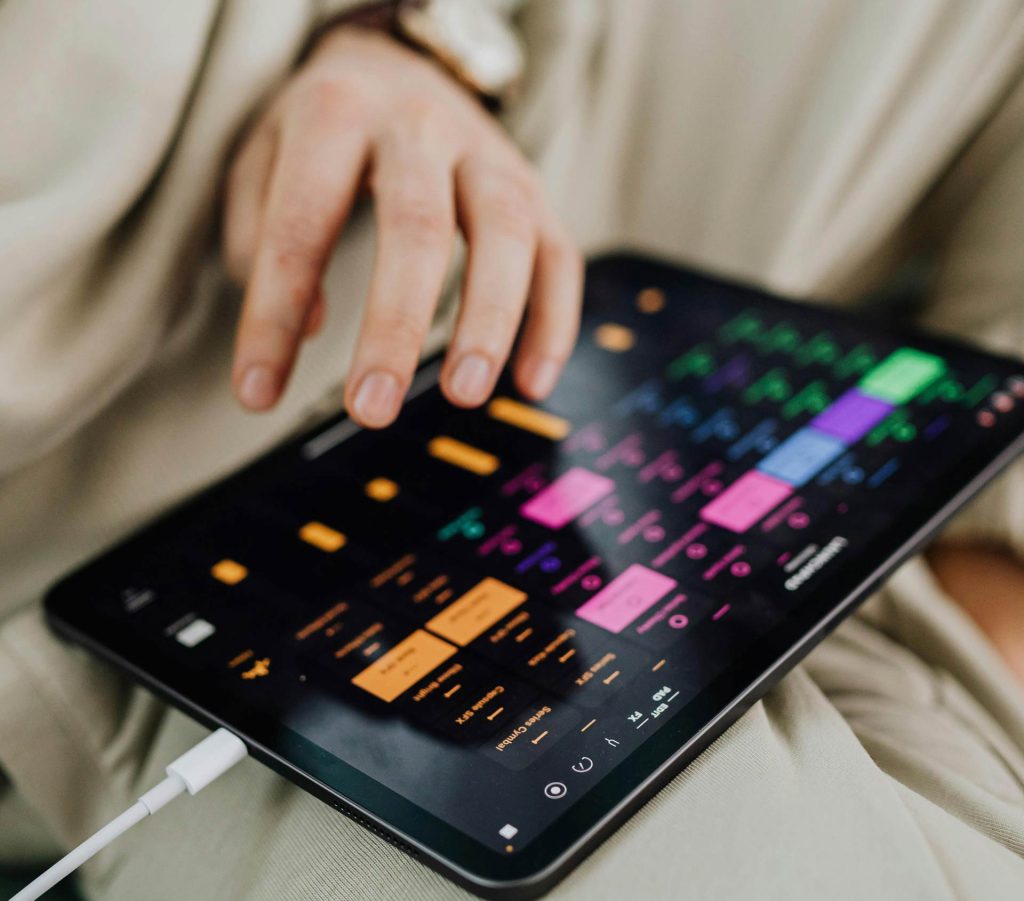 Tablet with various coloured graphs on screen