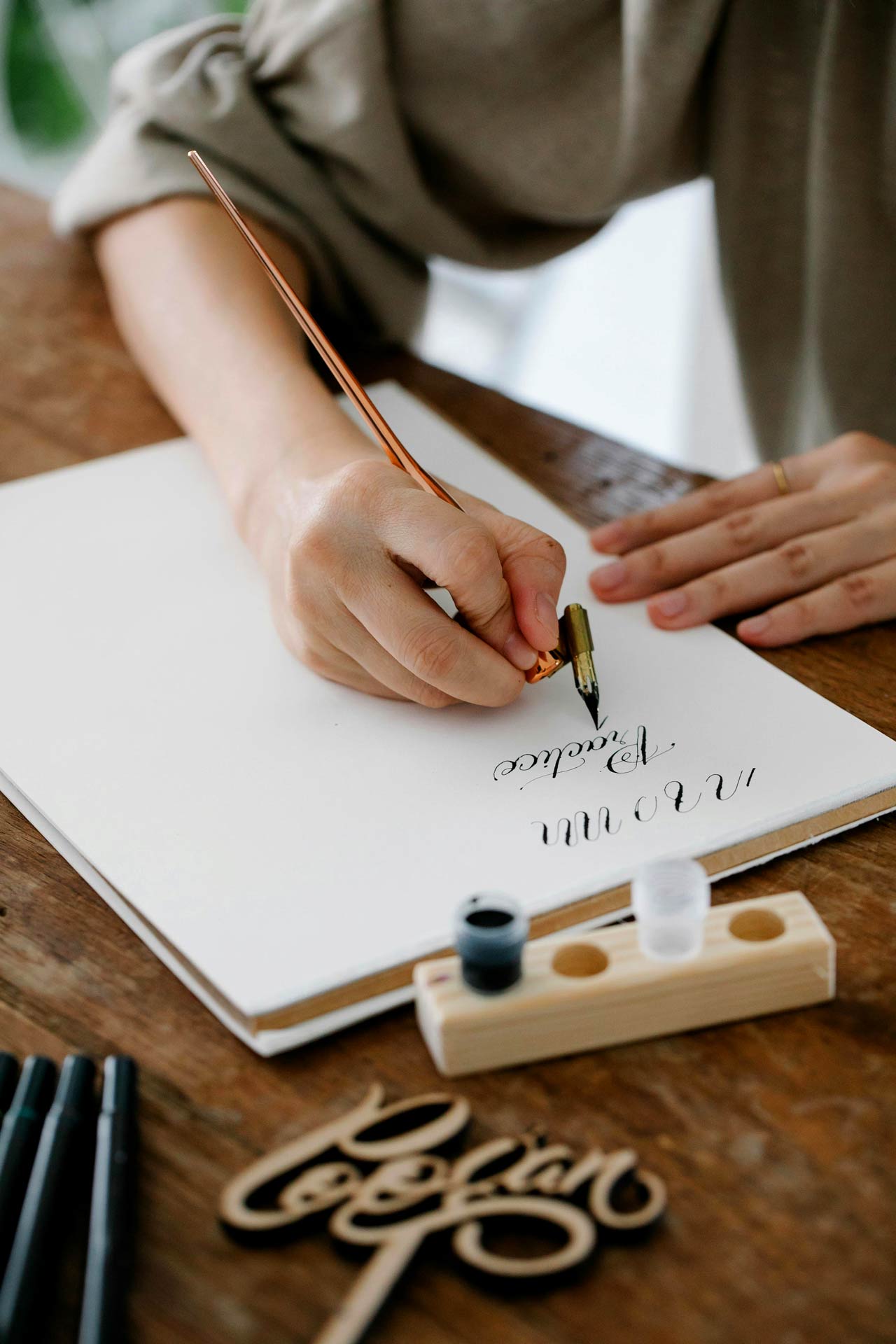 person doing caligraphy