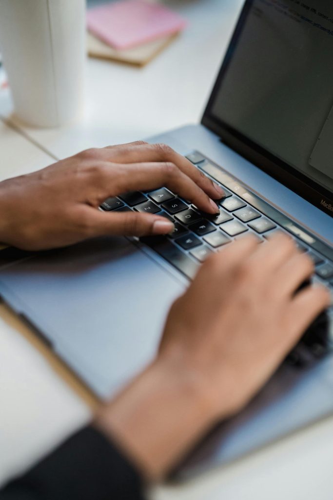 Person typing on keyboard